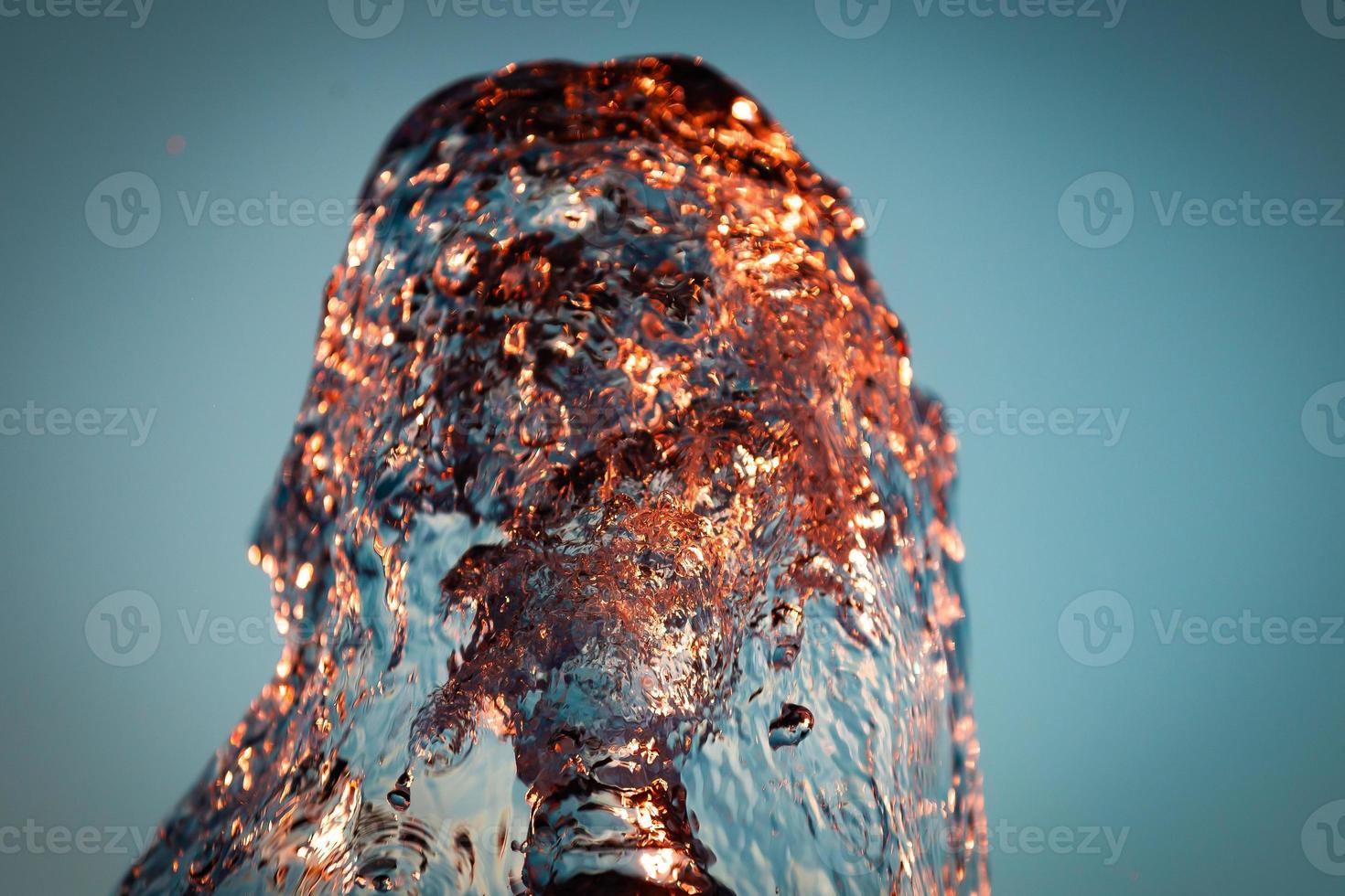 Abstract water background. Texture of water waves of a large fountain photo