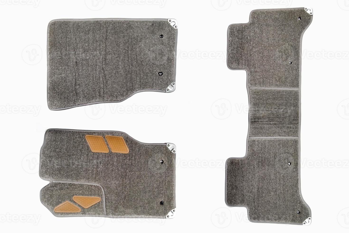 floor mats of carpet, velor for the front and rear seats of the car on a white isolated background, top view. photo