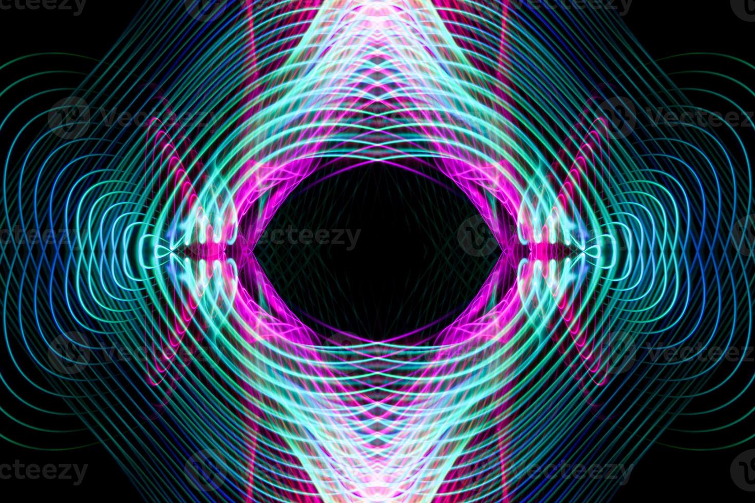 Abstract rainbow neon glowing crossing lines pattern. photo