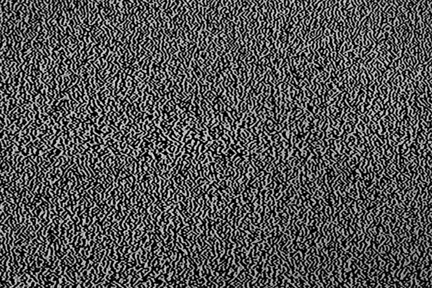 No signal on television or computer screen. Abstract background with black and white grainy noise effect in monitor. photo