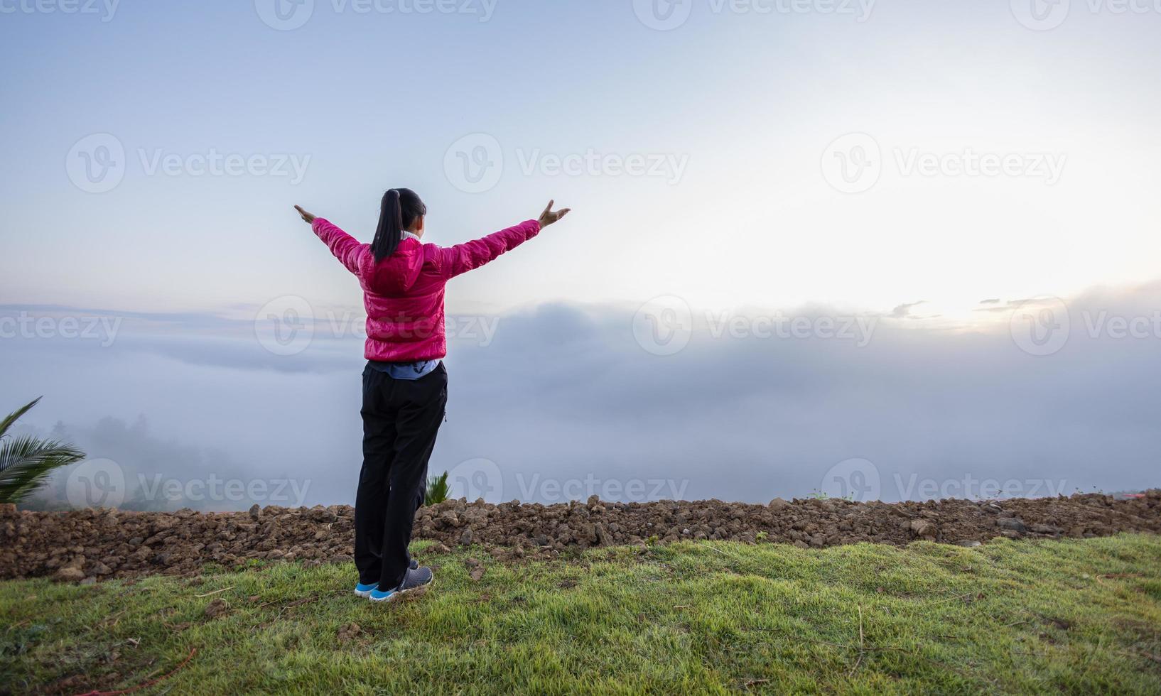 Woman praying in the morning on the sunrise background. Christianity concept. Pray background. Faith hope love concept. photo