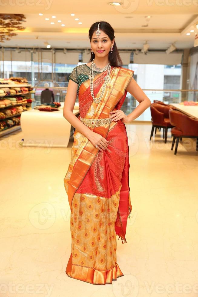 young lady set of jewelry and waist chain. traditional saree photo