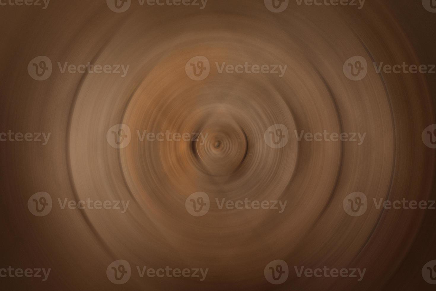 forma circular sobre fondo marrón foto