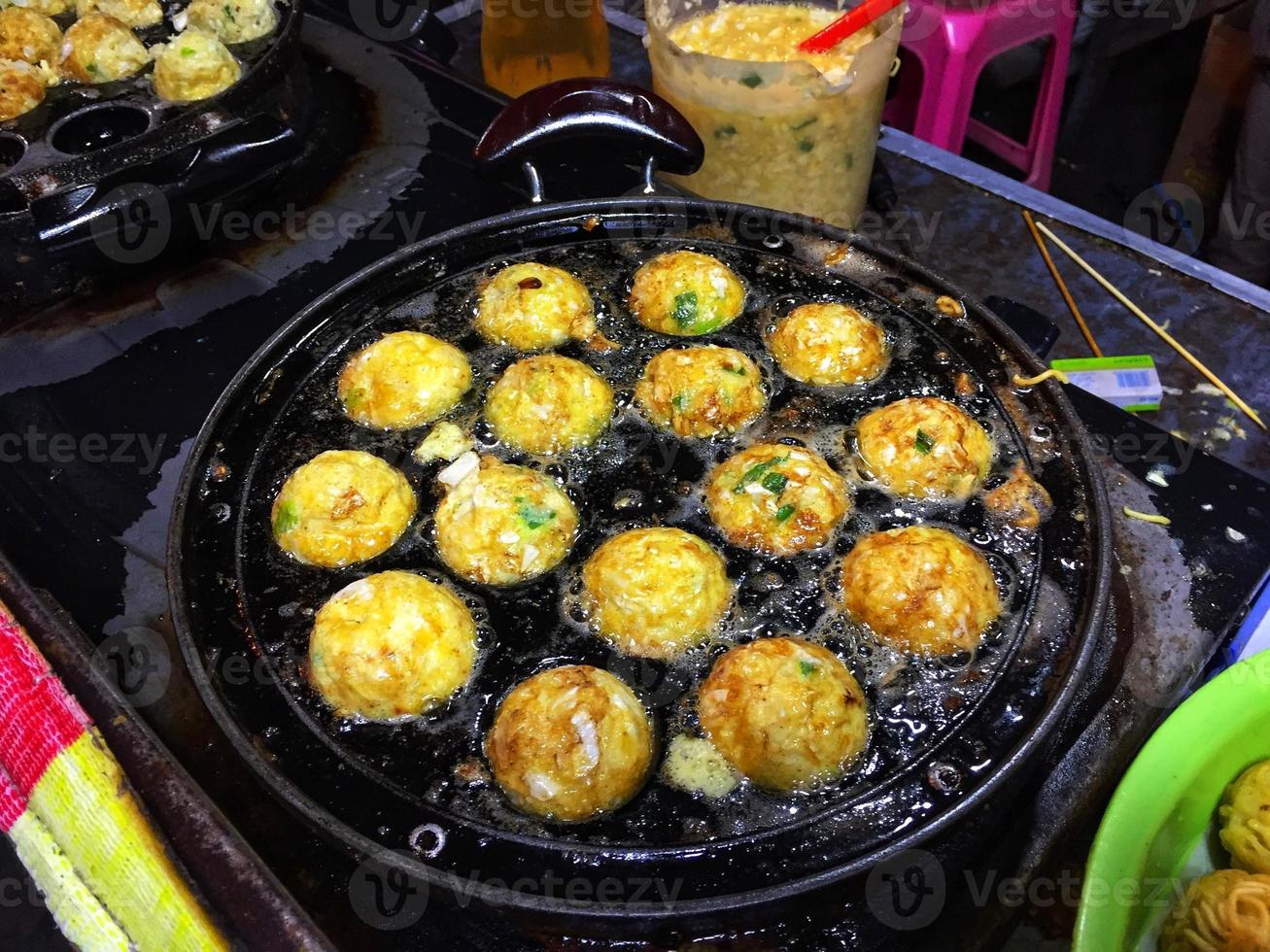 Fry mini eggs in small round pans photo