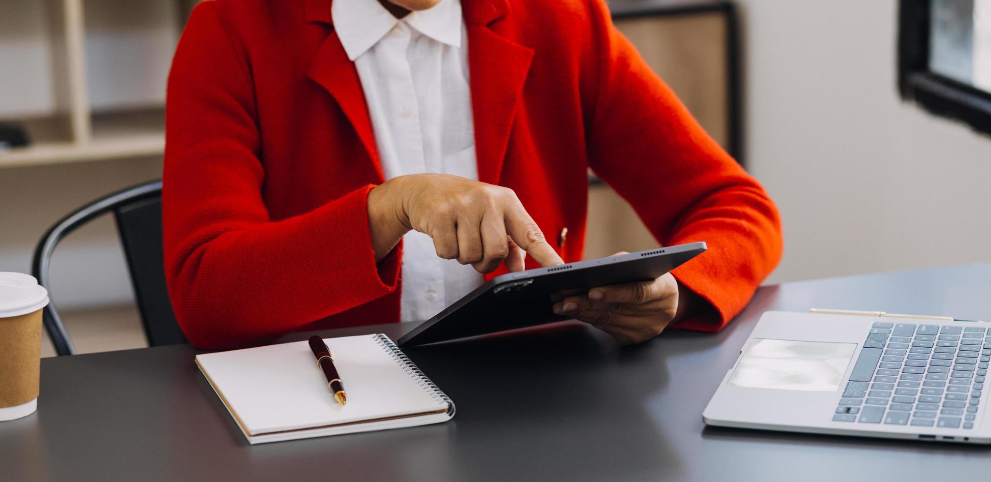 businesswoman hand working with laptop computer, tablet and smart phone in modern office with virtual icon diagram at modernoffice in morning light photo