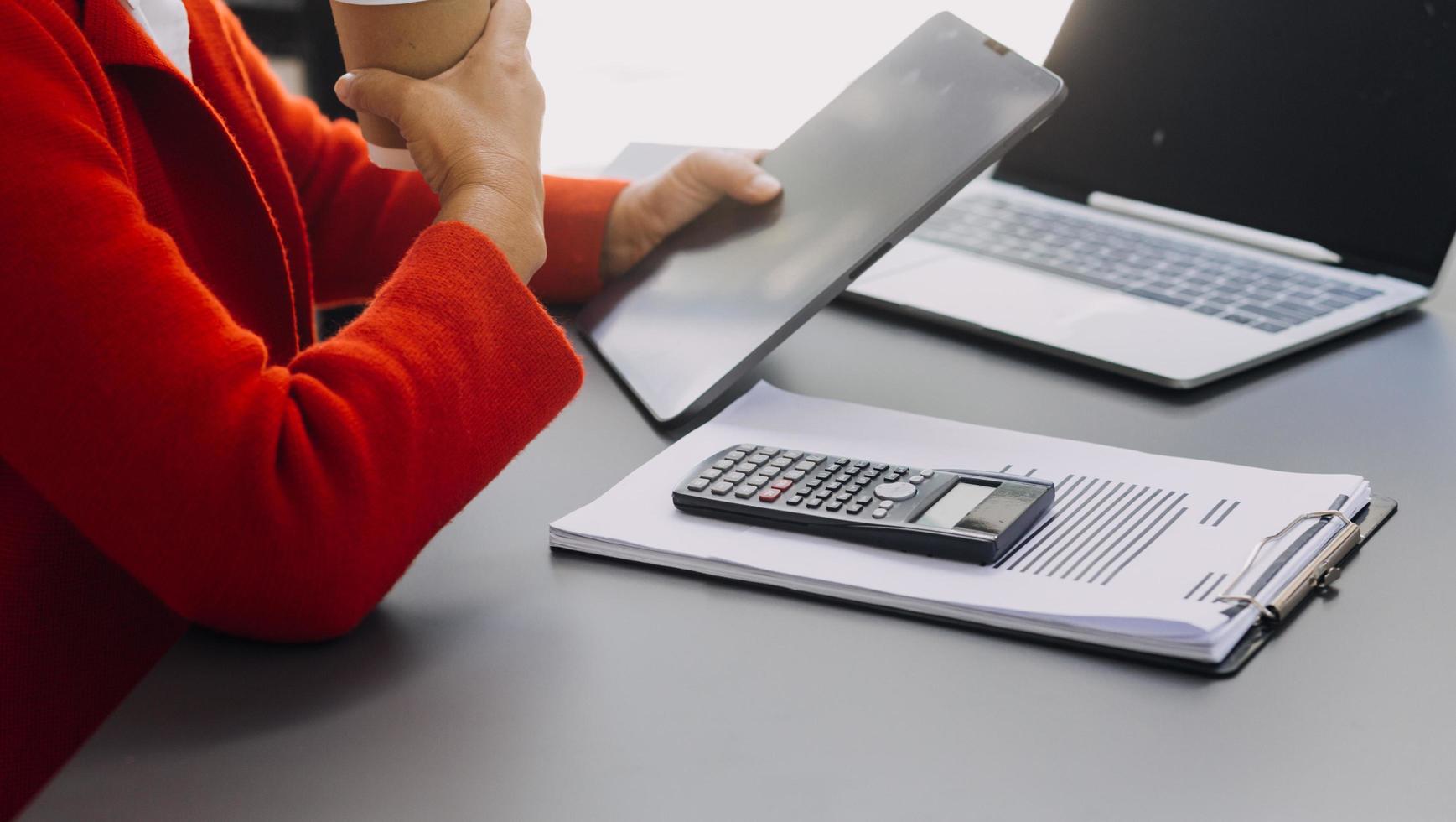 businesswoman hand working with laptop computer, tablet and smart phone in modern office with virtual icon diagram at modernoffice in morning light photo