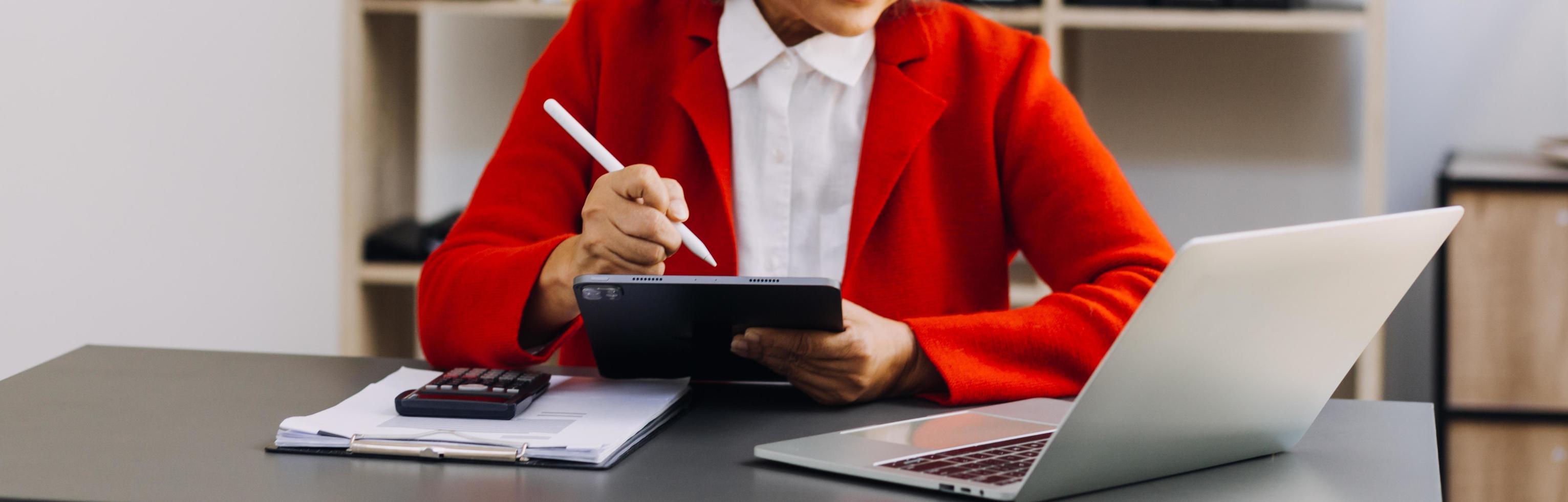 Businessman and team analyzing financial statement Finance task. with smart phone and laptop and tablet. Wealth management concept photo