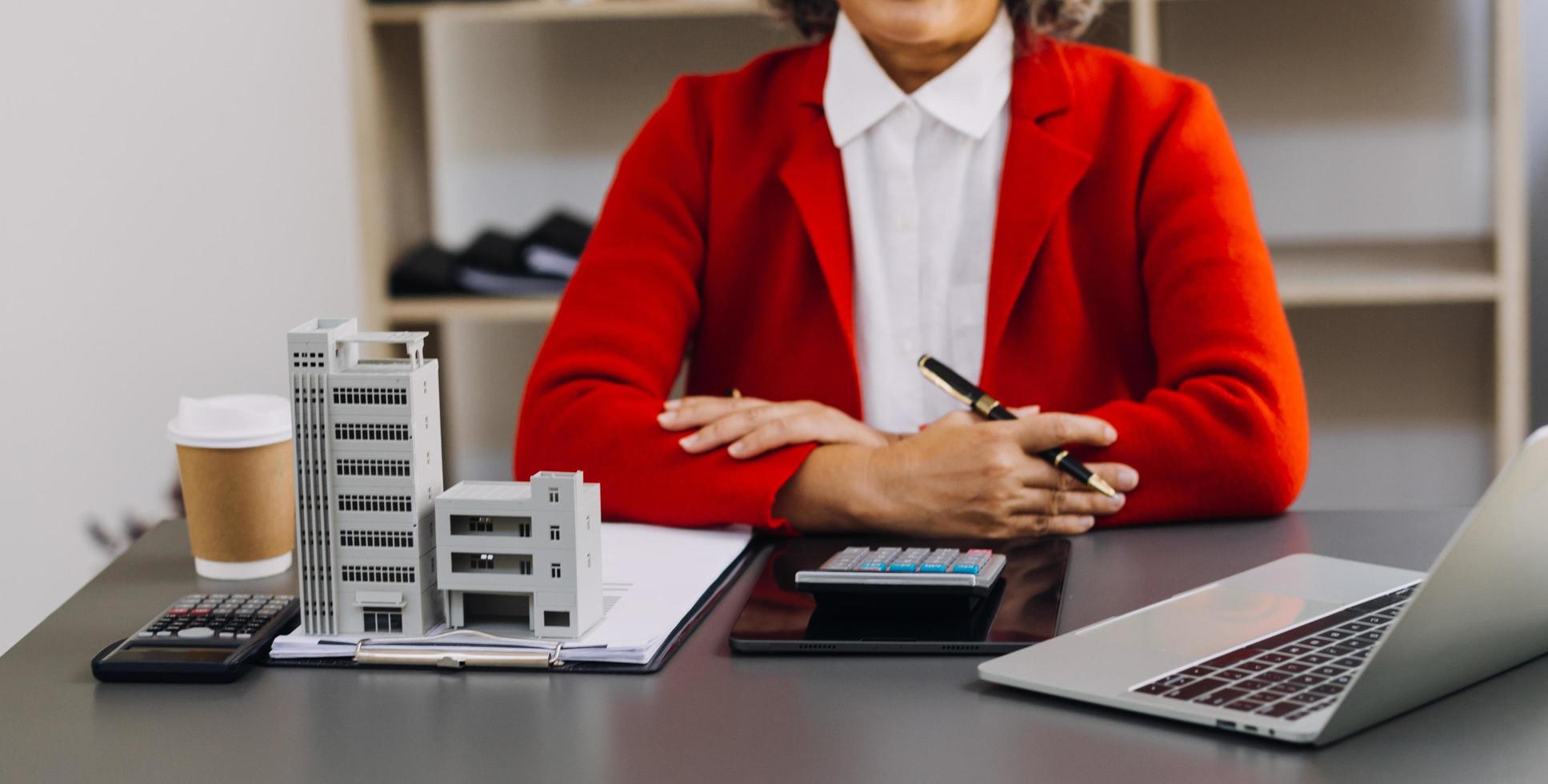 businesswoman hand working with laptop computer, tablet and smart phone in modern office with virtual icon diagram at modernoffice in morning light photo