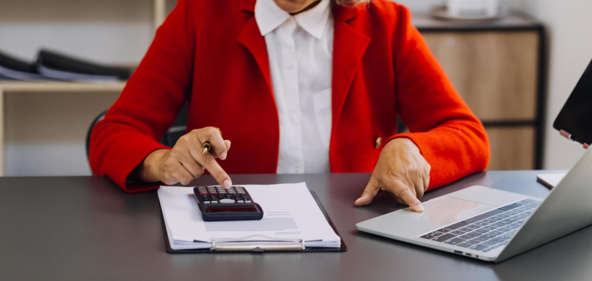 businesswoman hand working with laptop computer, tablet and smart phone in modern office with virtual icon diagram at modernoffice in morning light photo