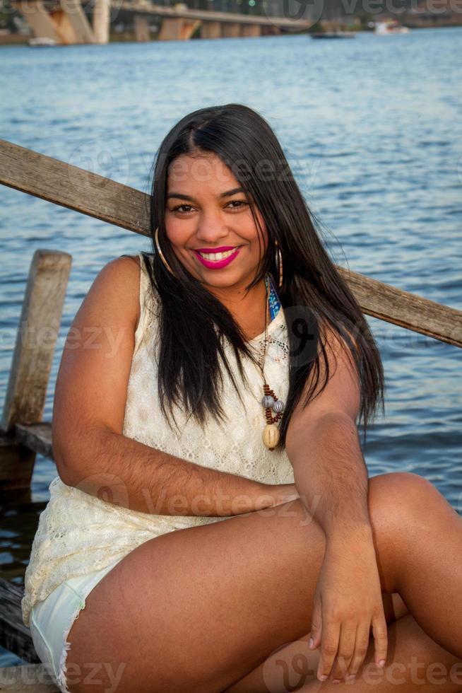 Lovely young Brazilian girl with a beautiful smile at the Park photo