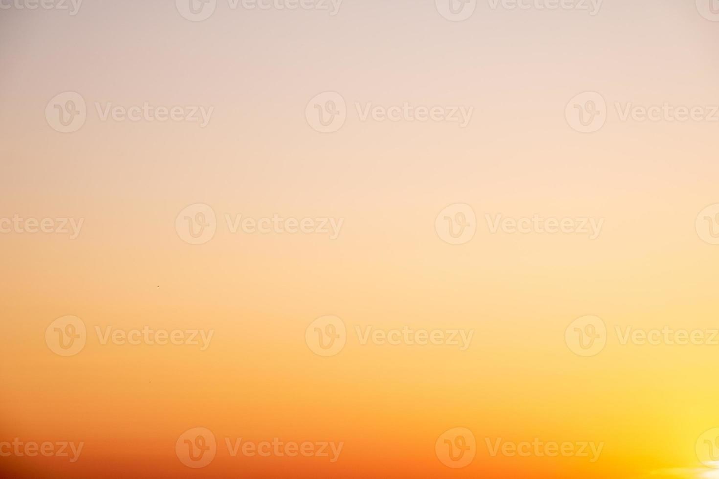 beautiful gradient orange clouds and sunlight on the blue sky perfect for the background, take in everning,Twilight photo