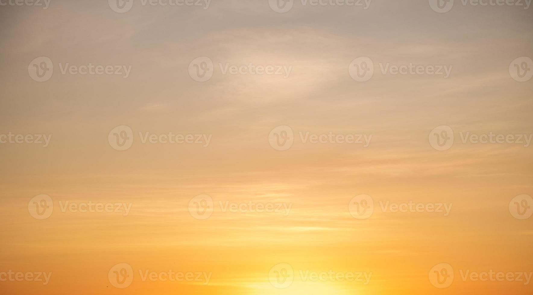 beautiful gradient orange clouds and sunlight on the blue sky perfect for the background, take in everning,Twilight photo