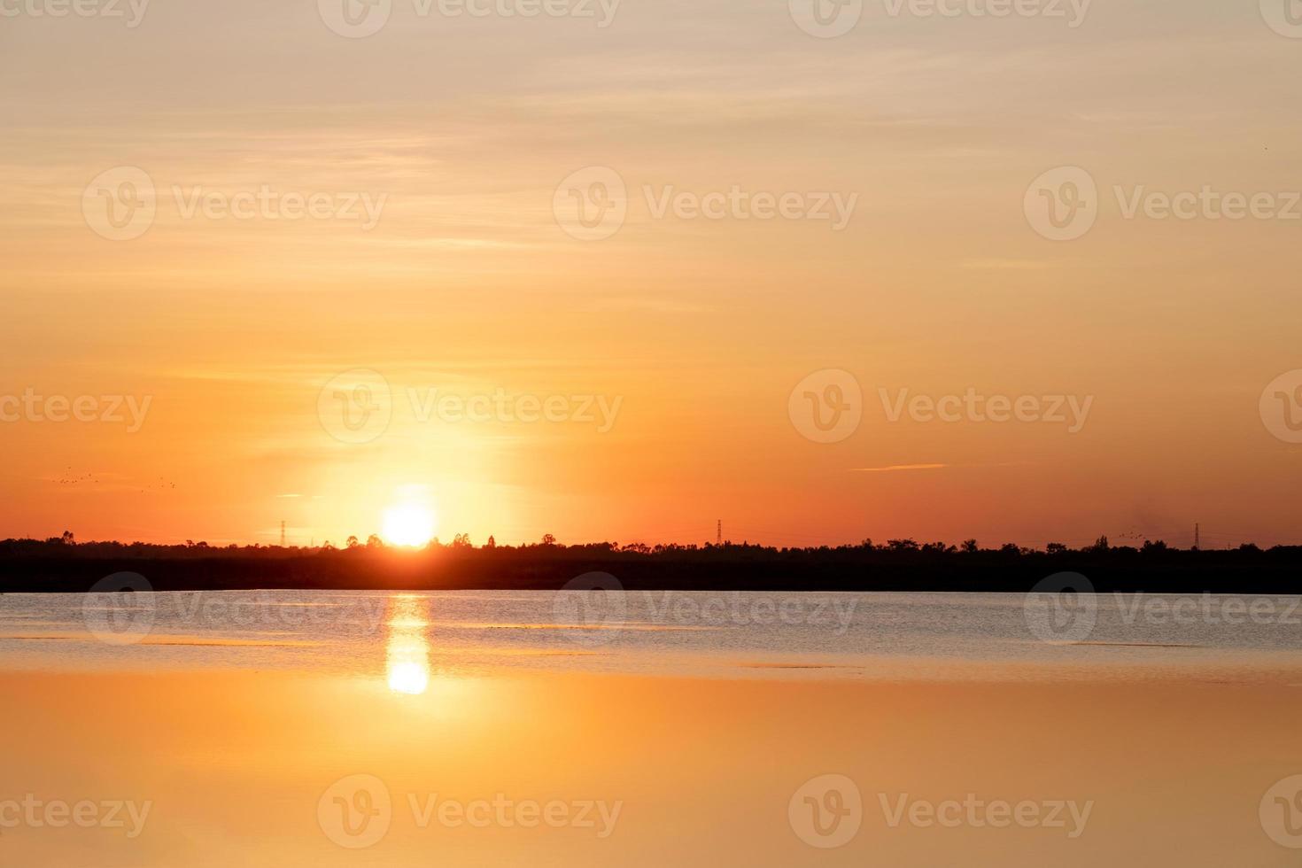 beautiful gradient orange clouds and sunlight on the blue sky perfect for the background, take in everning,Twilight photo