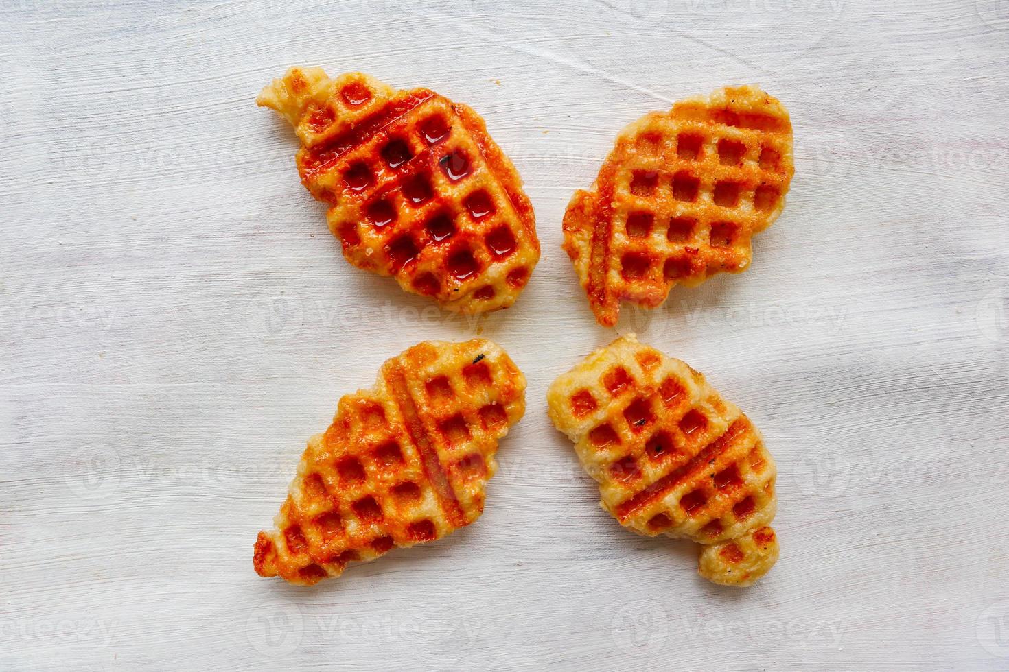Croissant Waffle or Croffle with chocolate sauce served in box and white background photo