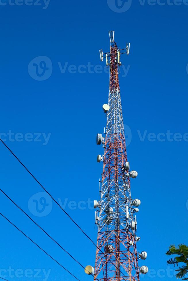 communication tower. Telco Trellis for 3G 4G 5G Apocalypse Internet Communication, mobile, FM Radio and Television Broadcasting On Air with Blue Sky in Background photo