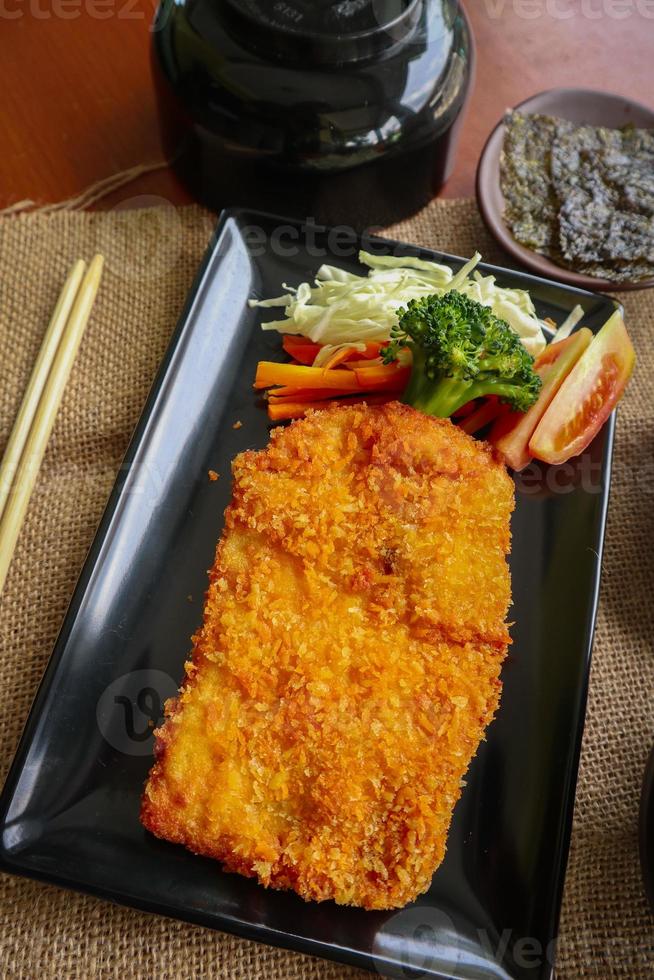 chicken katsu don is japanese food served with soy sauce on table 15957401 Stock Photo at Vecteezy