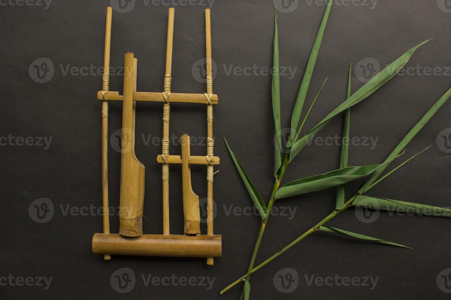 Angklung, the traditional sundanese musical instrument made from bamboo. Isolated on white background photo