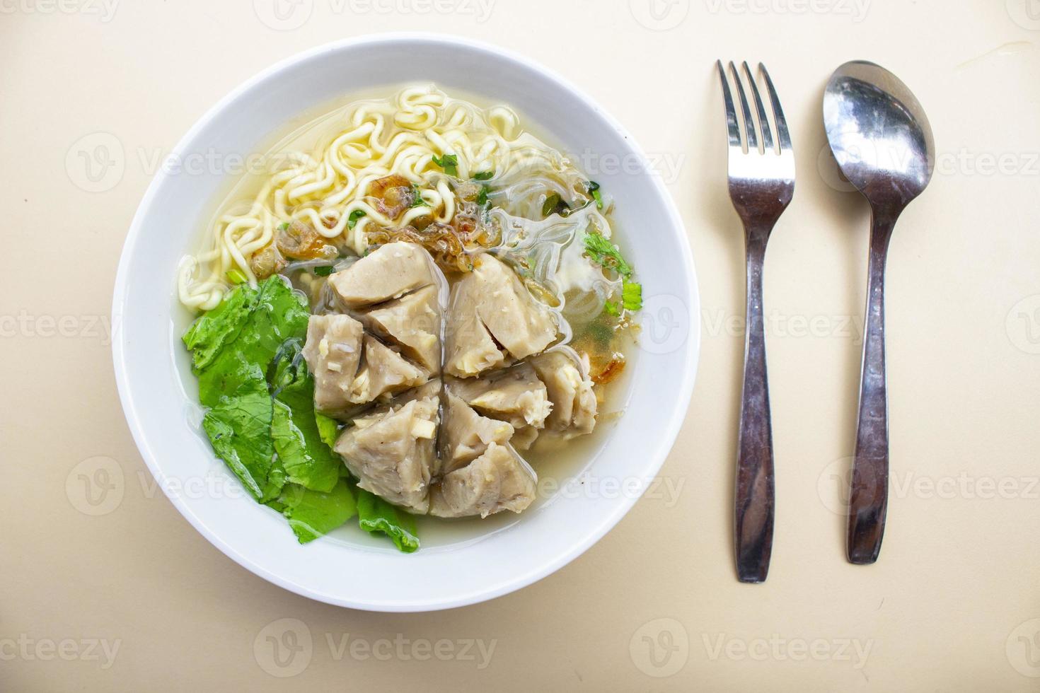 Bakso urat or meatball muscles is popular traditional food made from meat and cow muscles served with vegetables, noodle and flavour soup photo