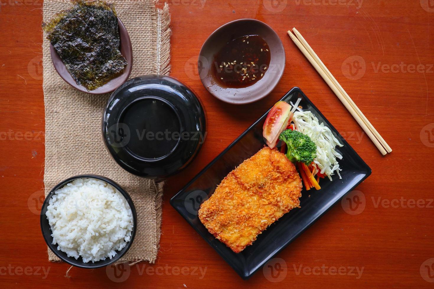 chicken katsu don is japanese food served with soy sauce on table 15957646 Stock Photo at Vecteezy