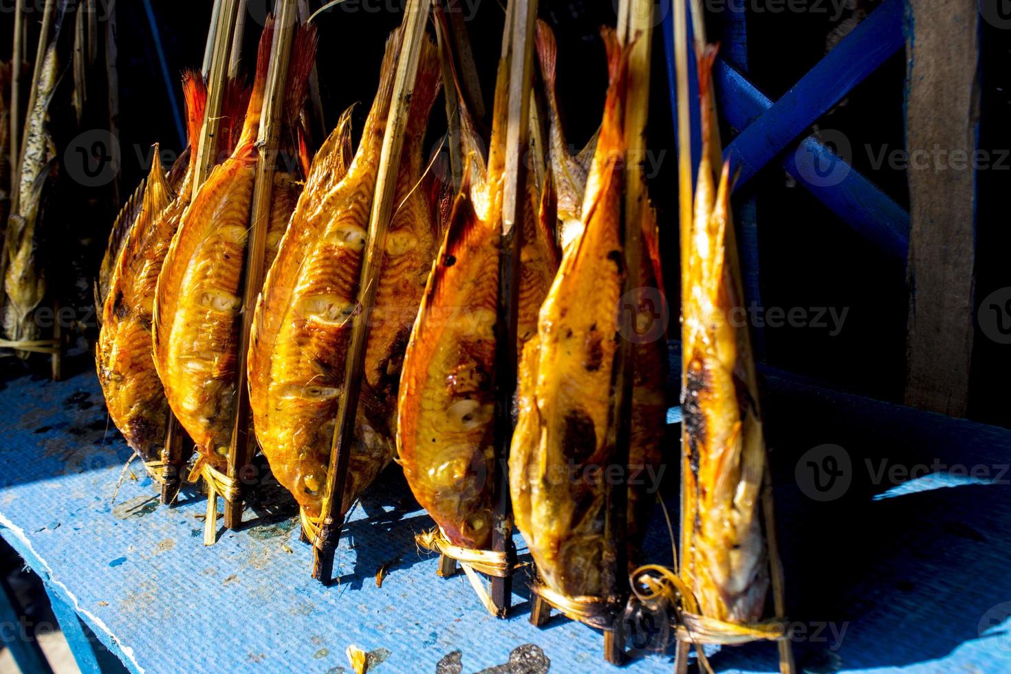 grilled fish, grilled fish nile Tilapia grilled on hot charcoal photo