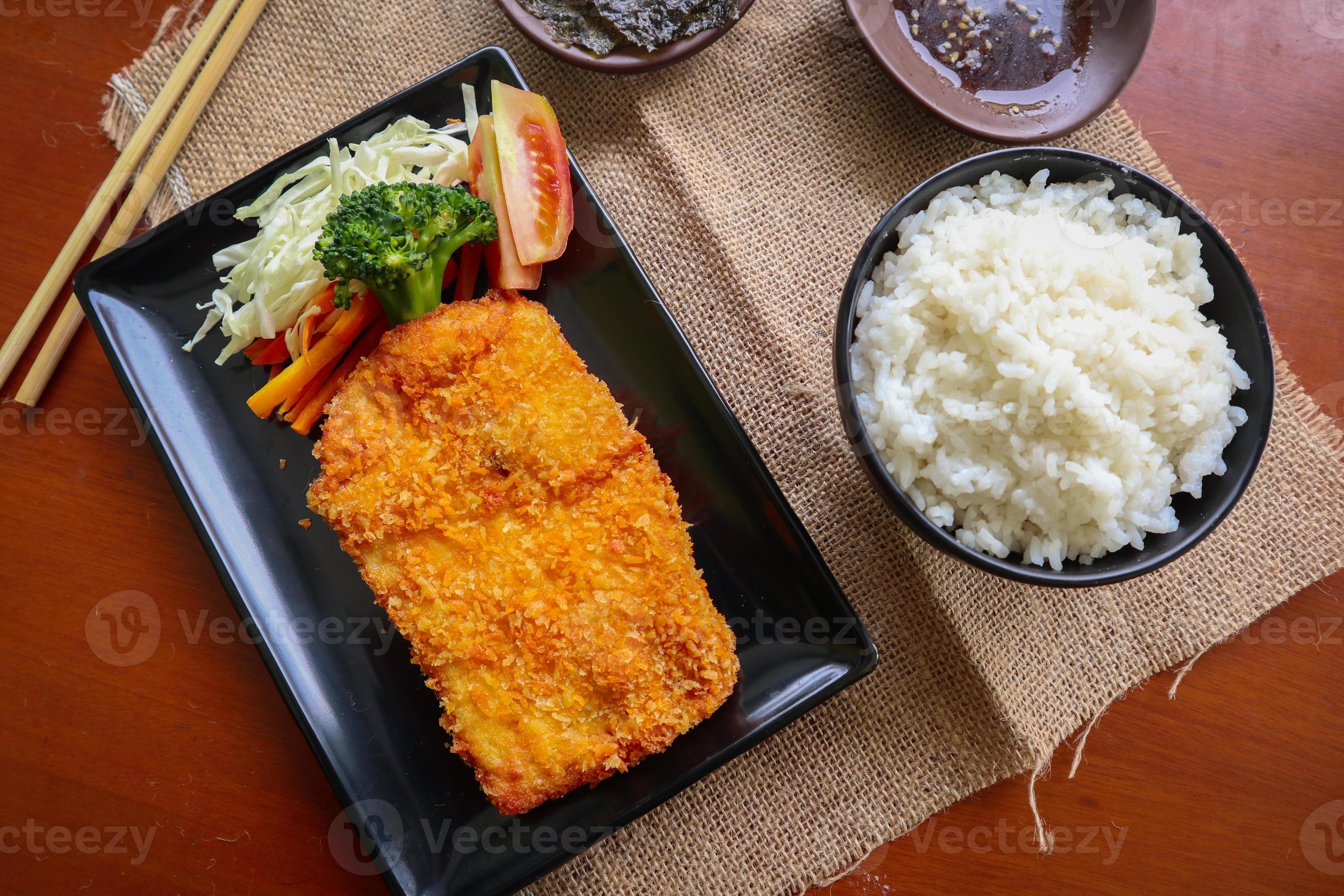chicken katsu don is japanese food served with soy sauce on table 15957768 Stock Photo at Vecteezy