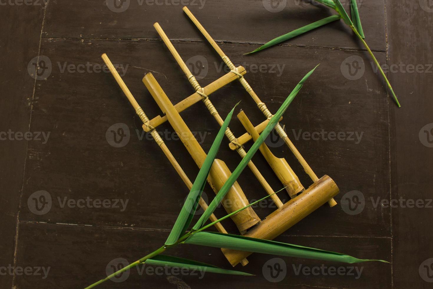 Angklung, the traditional sundanese musical instrument made from bamboo. Isolated on white background photo
