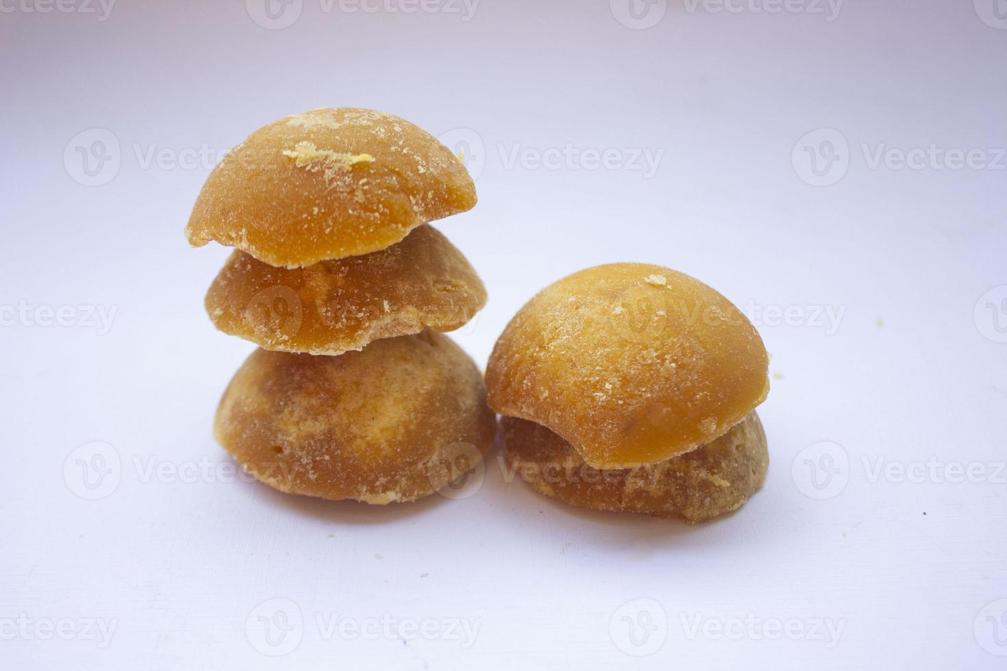 brown sugar or java sugar or palm sugar or gula jawa isolated on white background. Top view. Flat lay. sweet photo
