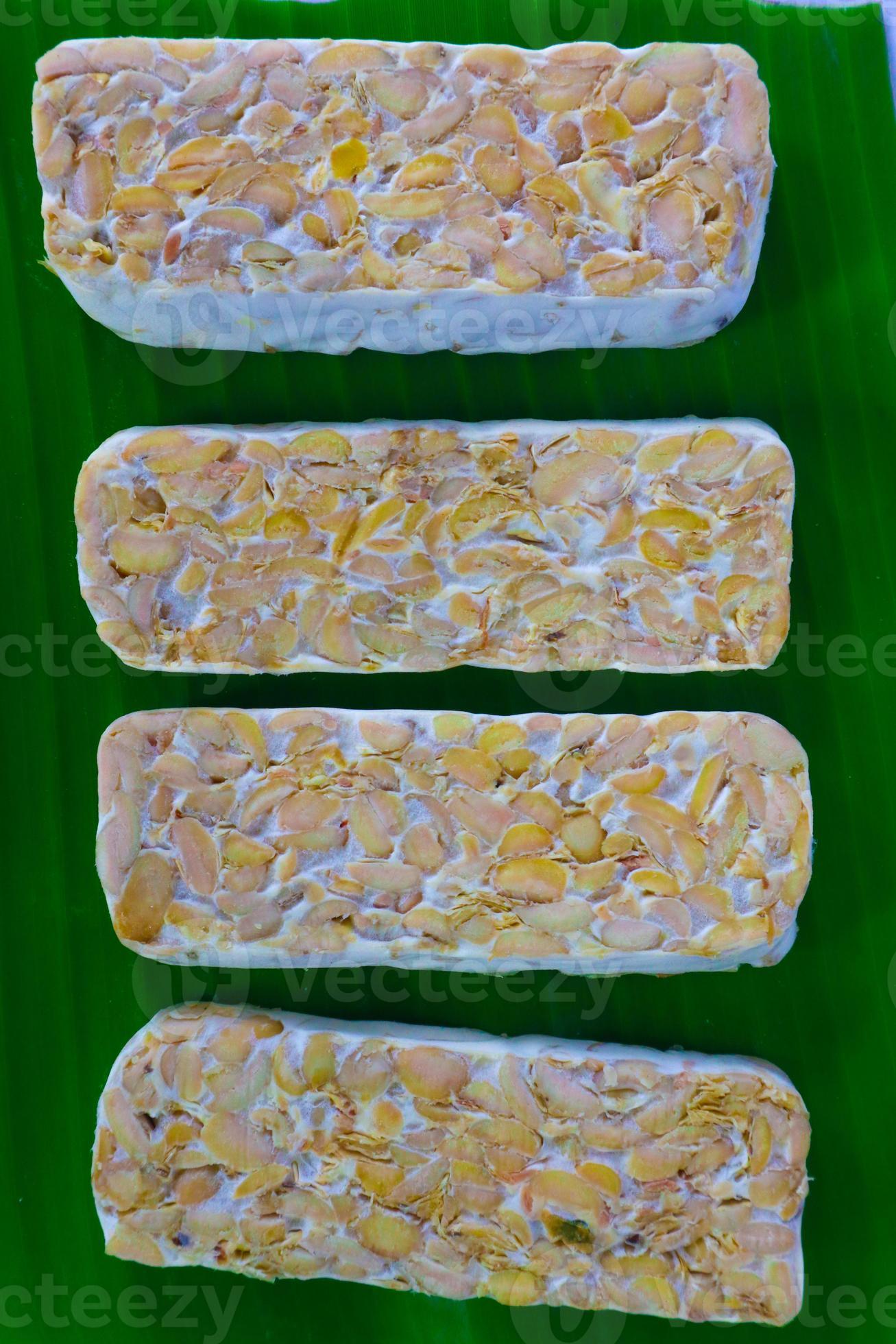 Raw tempeh or tempe. tempeh slices in white background. raw soybean