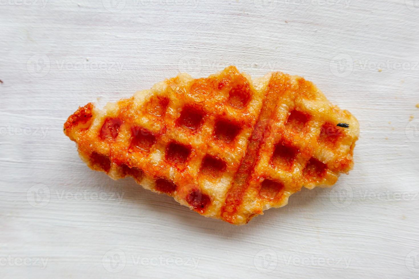 Croissant Waffle or Croffle with chocolate sauce served in box and white background photo