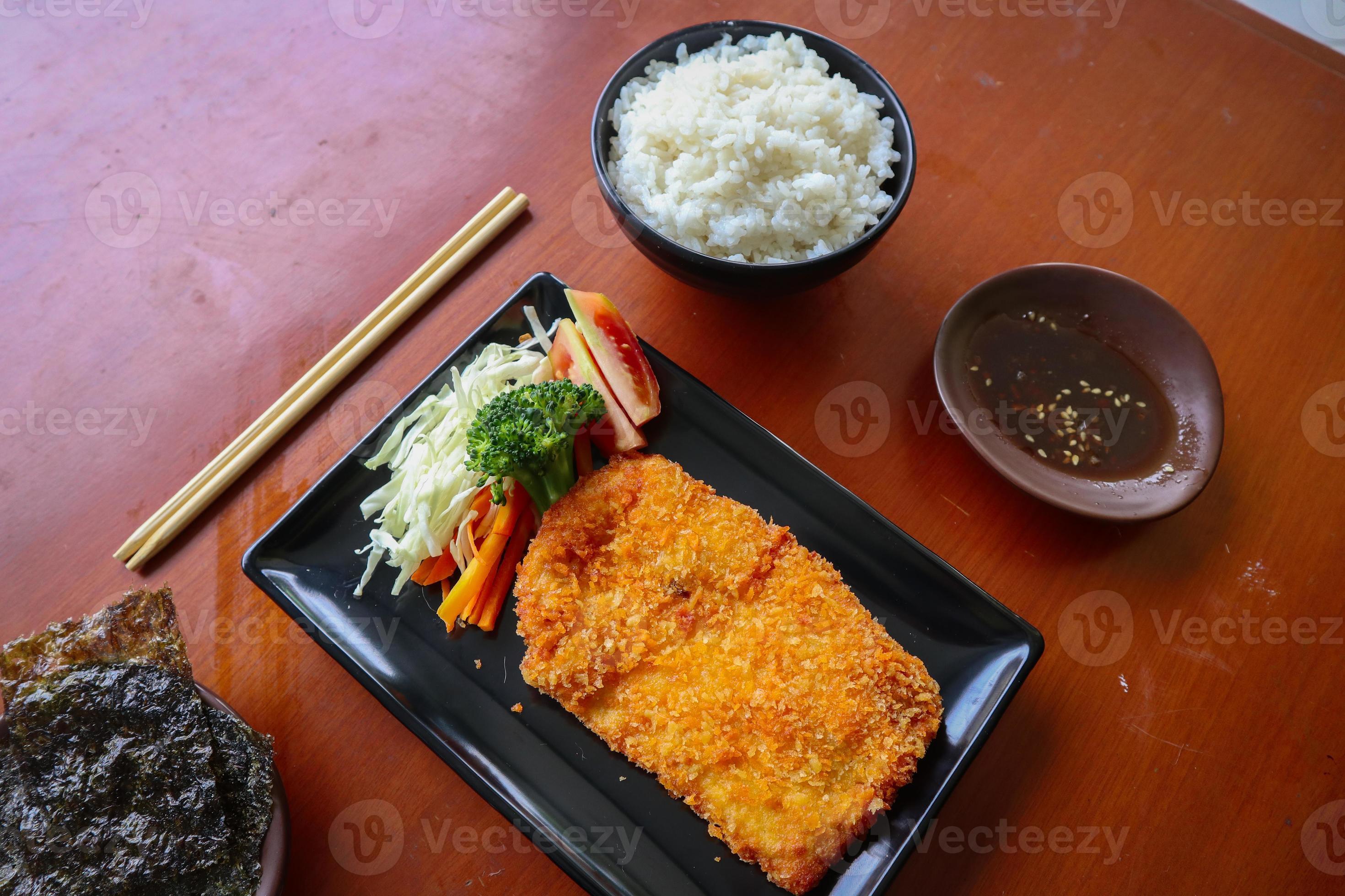 chicken katsu don is japanese food served with soy sauce on table 15958443 Stock Photo at Vecteezy