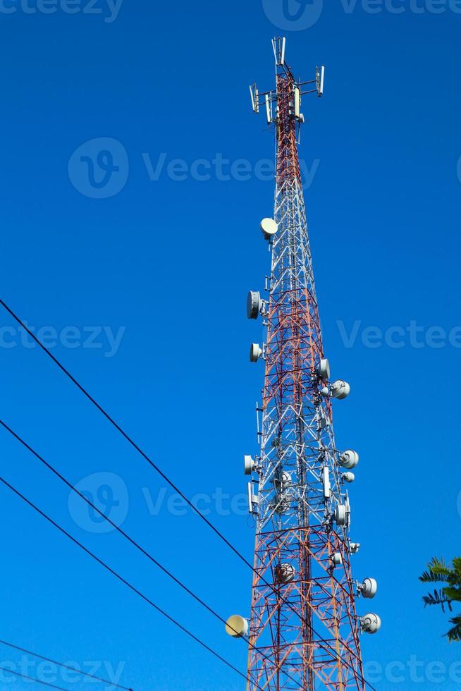 communication tower. Telco Trellis for 3G 4G 5G Apocalypse Internet Communication, mobile, FM Radio and Television Broadcasting On Air with Blue Sky in Background photo