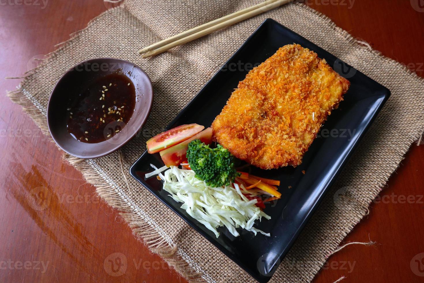 chicken katsu don is japanese food served with soy sauce on table 15958460 Stock Photo at Vecteezy