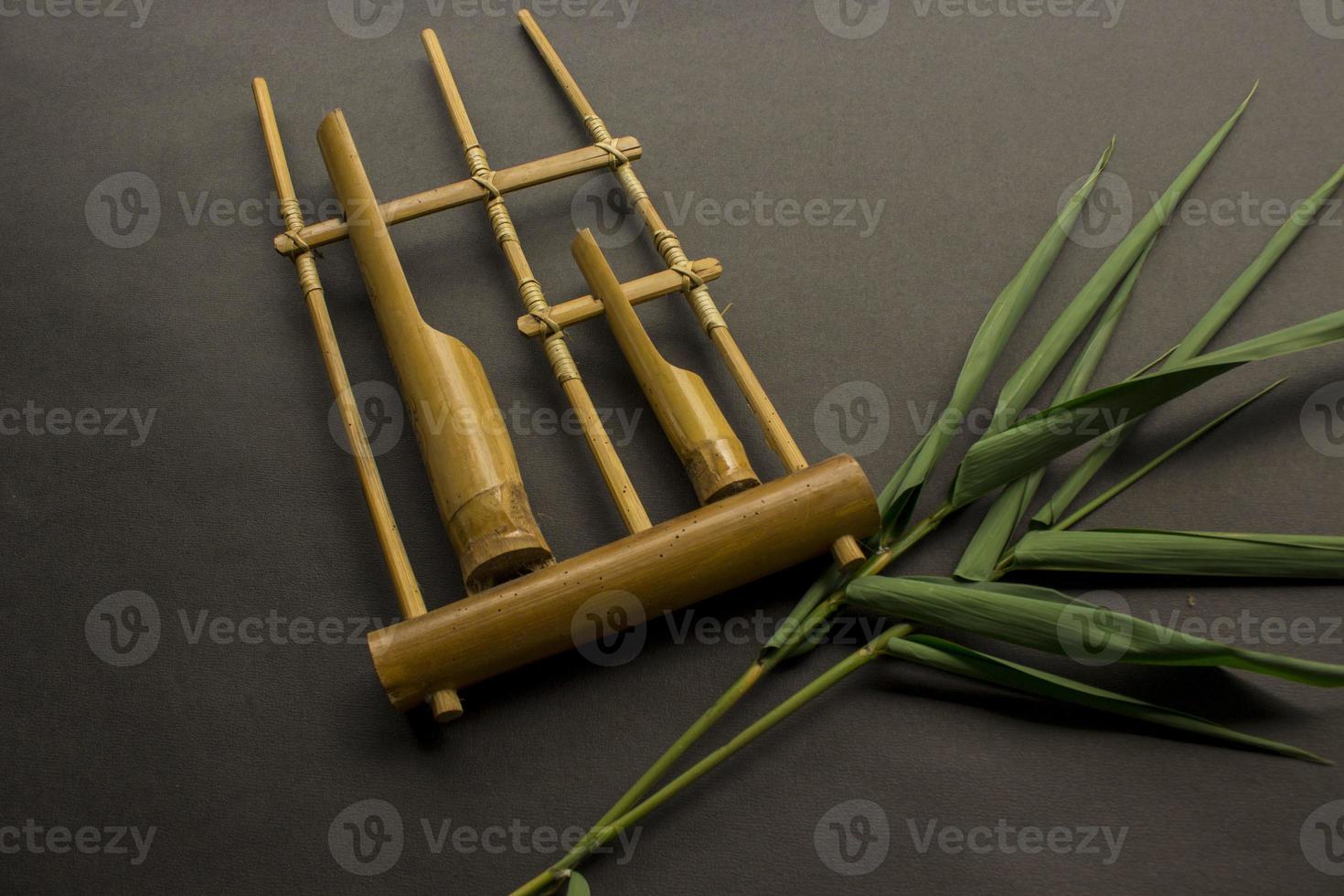 Angklung, the traditional sundanese musical instrument made from bamboo. Isolated on white background photo