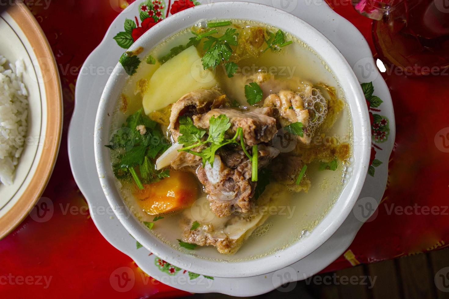 sop buntut or oxtail soup or tail soup is traditional soup made from tail ox, Boiled with Spices photo