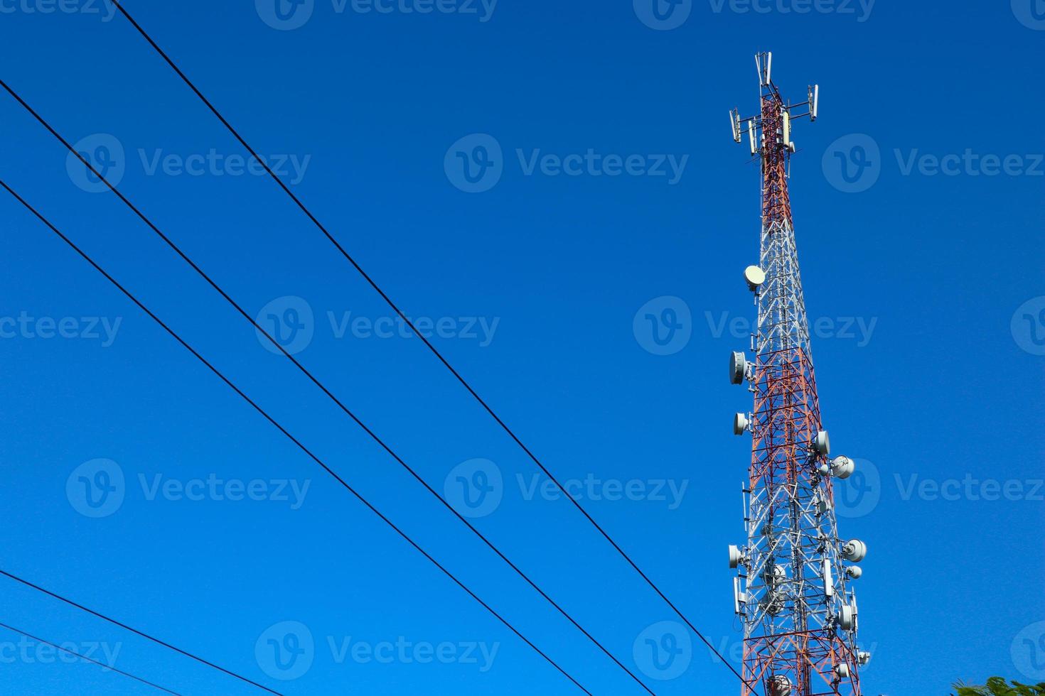 communication tower. Telco Trellis for 3G 4G 5G Apocalypse Internet Communication, mobile, FM Radio and Television Broadcasting On Air with Blue Sky in Background photo