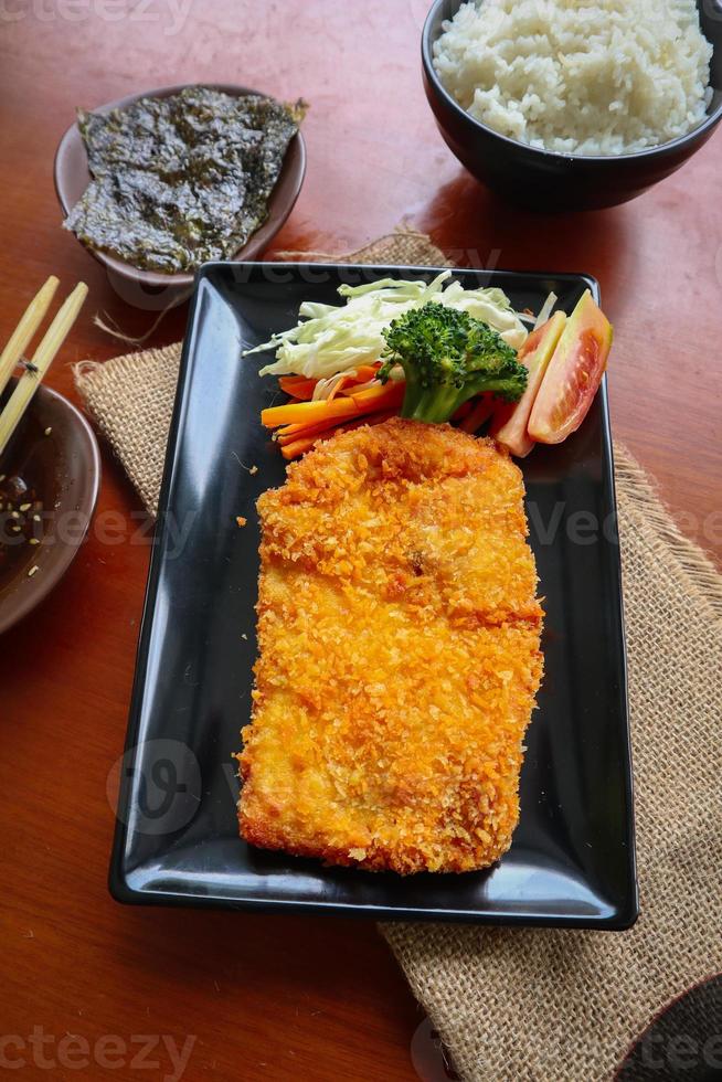 chicken katsu don is japanese food served with soy sauce on table 15959837 Stock Photo at Vecteezy