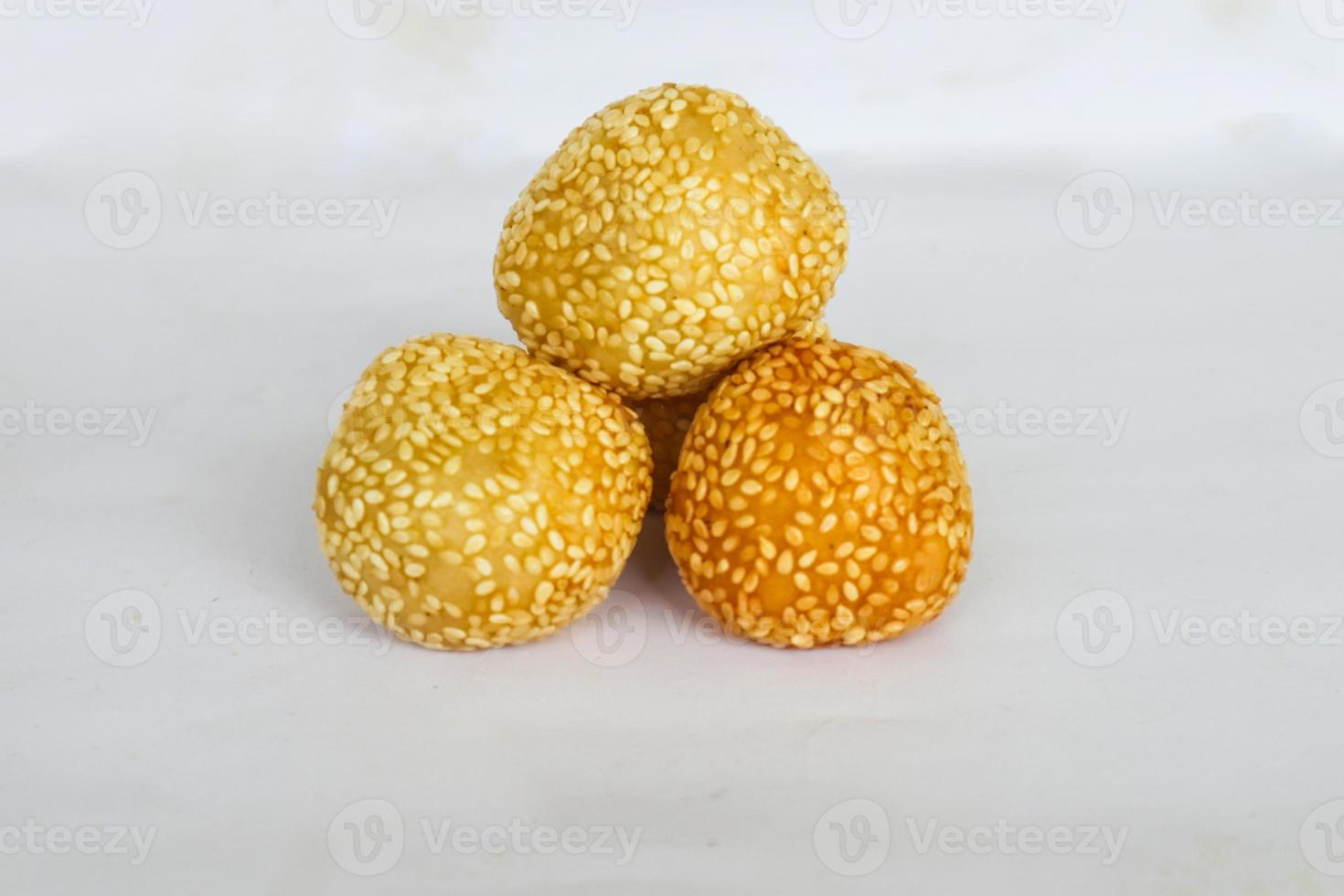 onde-onde or sesame ball or Jian Dui is fried Chinese pastry made from glutinous rice flour and coated with sesame seeds filled with bean paste. isolated on white background photo