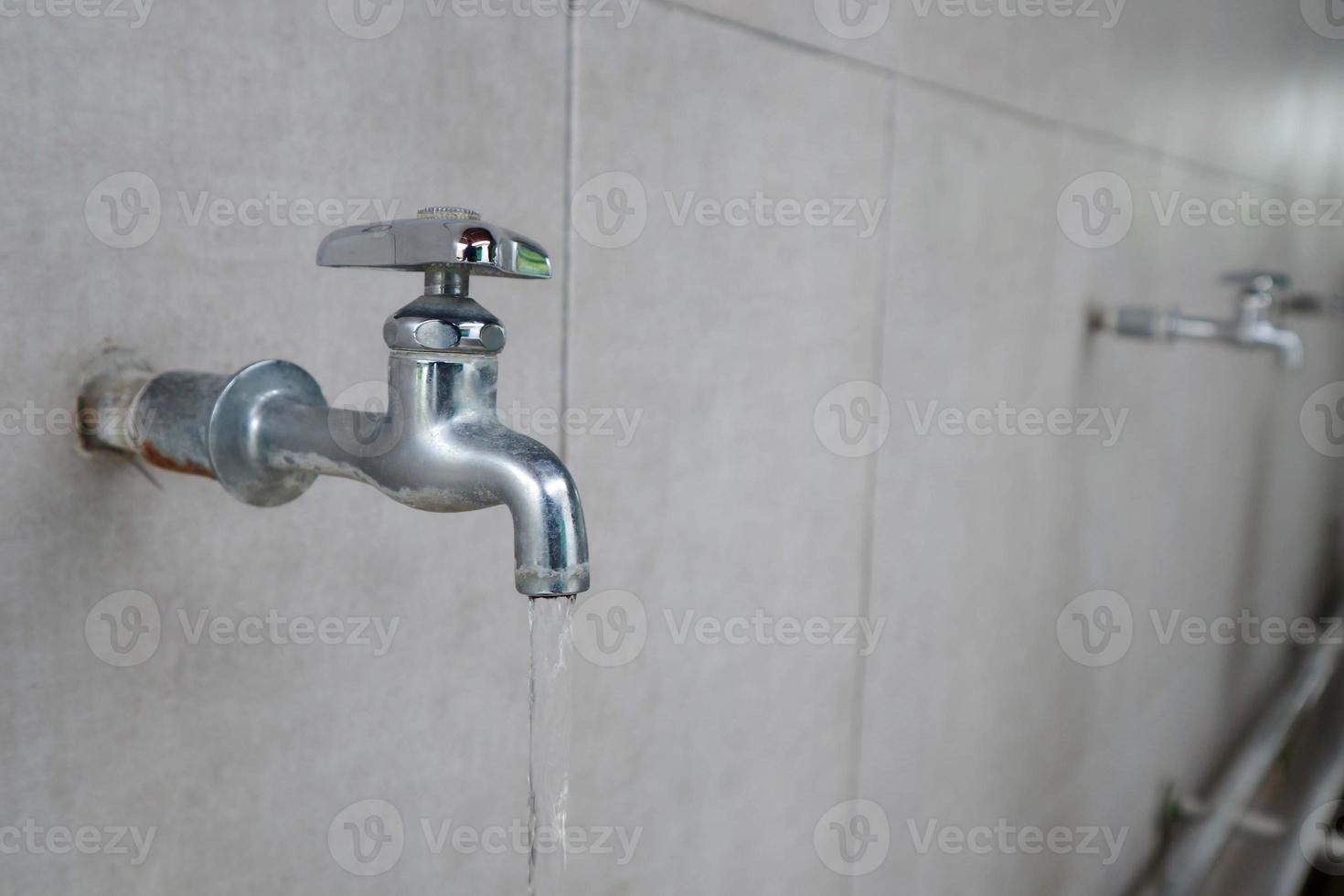 water faucet or water tab on ceramic wall photo