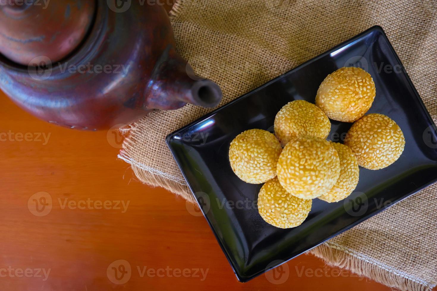 onde-onde or sesame ball or Jian Dui is fried Chinese pastry made from glutinous rice flour and coated with sesame seeds filled with bean paste. isolated on white background photo