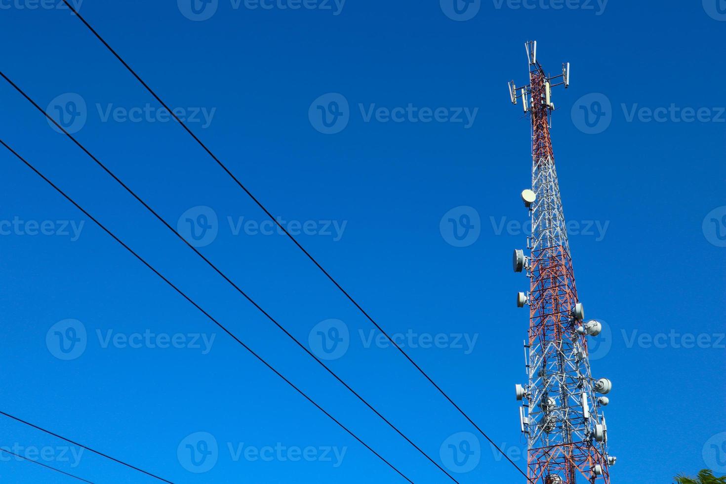 communication tower. Telco Trellis for 3G 4G 5G Apocalypse Internet Communication, mobile, FM Radio and Television Broadcasting On Air with Blue Sky in Background photo