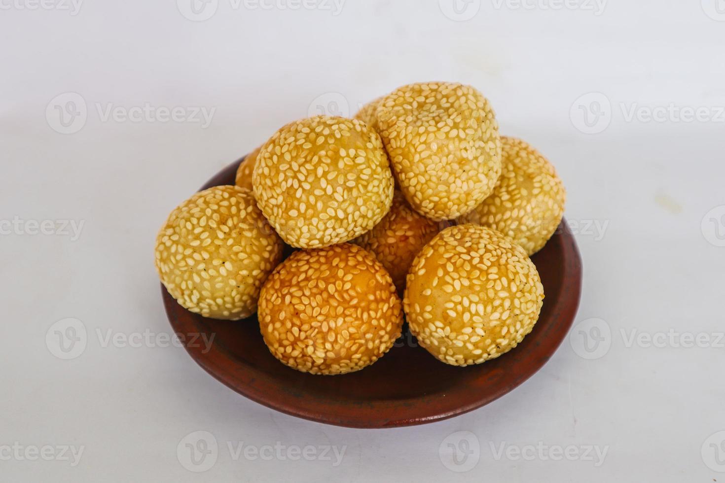 onde-onde or sesame ball or Jian Dui is fried Chinese pastry made from glutinous rice flour and coated with sesame seeds filled with bean paste. isolated on white background photo