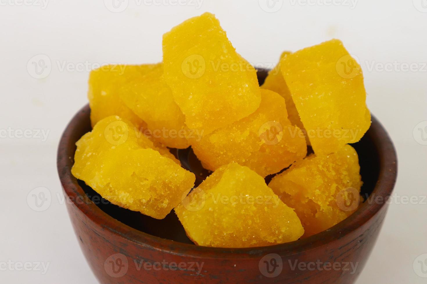 rock sugar on earthenware bowl, isolated on white background photo