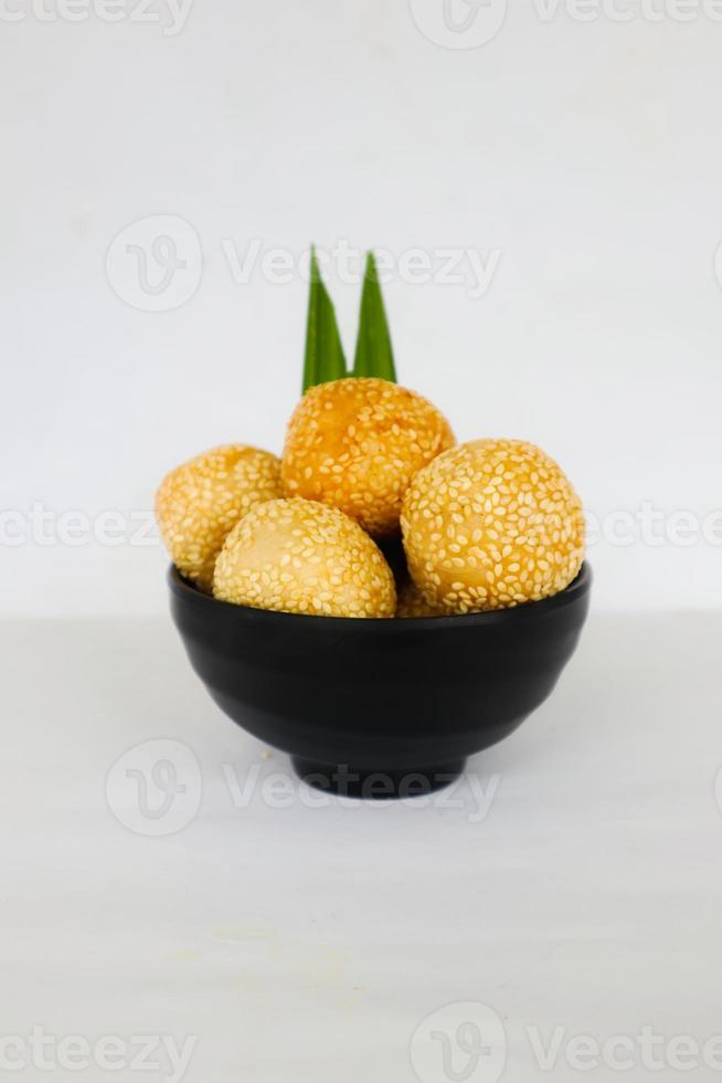 onde-onde or sesame ball or Jian Dui is fried Chinese pastry made from glutinous rice flour and coated with sesame seeds filled with bean paste. isolated on white background photo