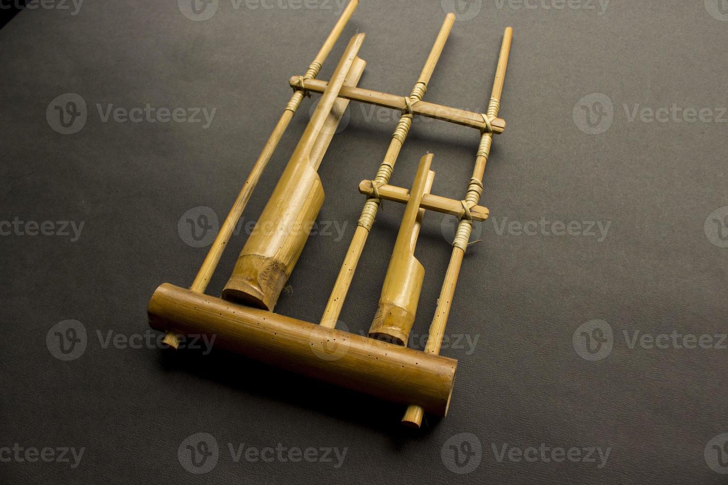 Angklung, the traditional sundanese musical instrument made from bamboo. Isolated on white background photo