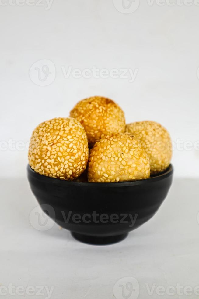 onde-onde or sesame ball or Jian Dui is fried Chinese pastry made from glutinous rice flour and coated with sesame seeds filled with bean paste. isolated on white background photo