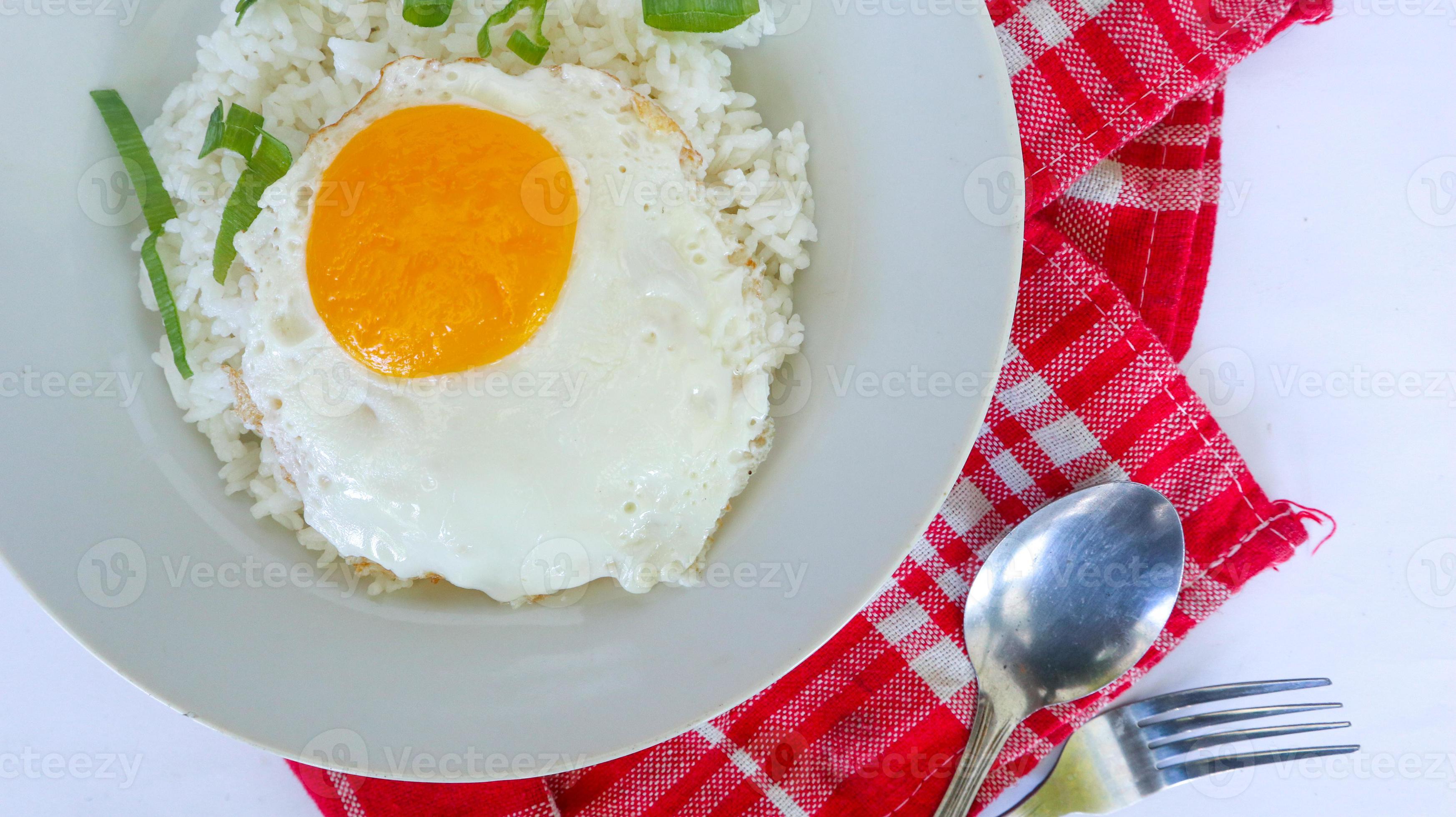fried egg rice. breakfast fried egg sunny side rice on a plate