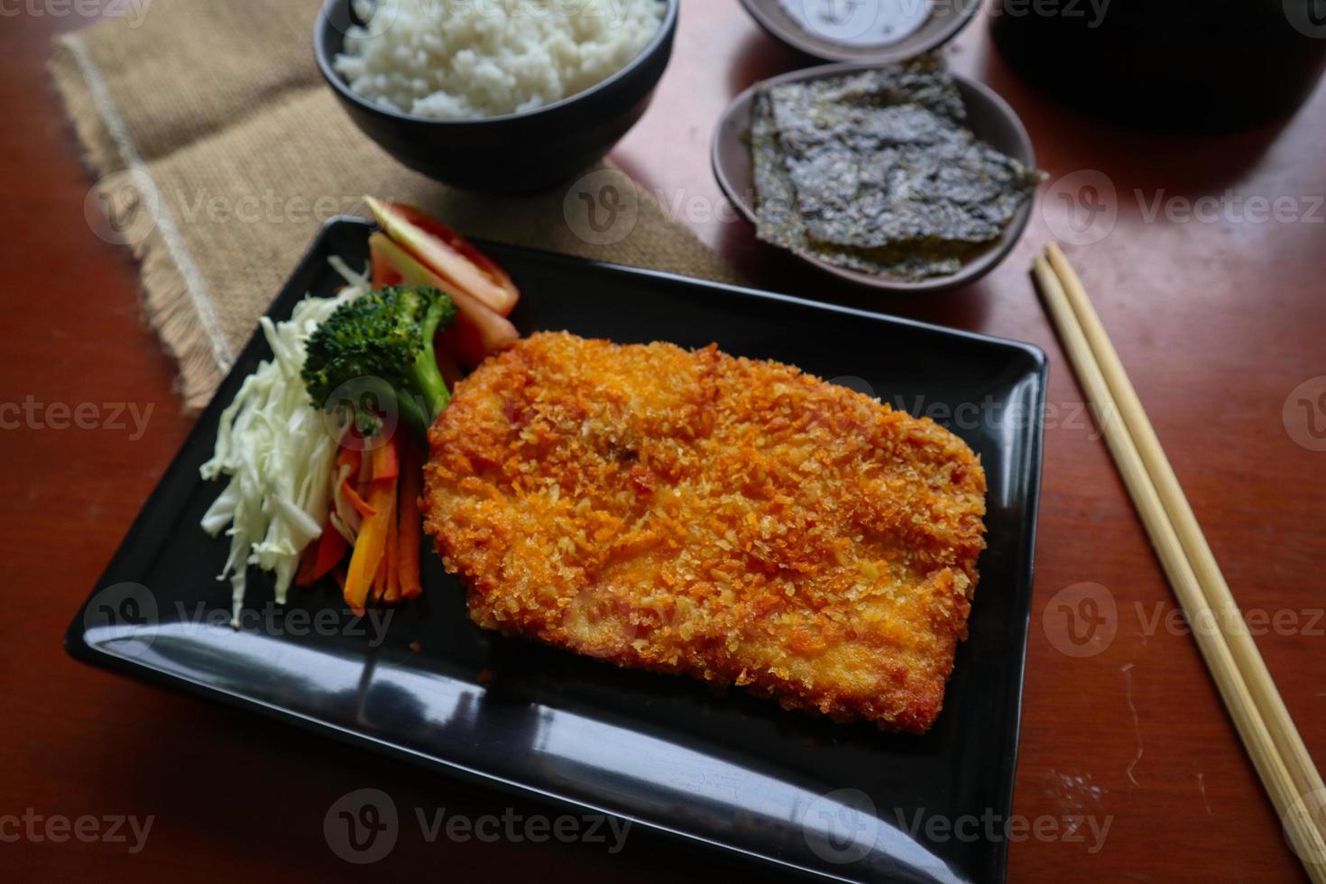 chicken katsu don is japanese food served with soy sauce on table 15966622 Stock Photo at Vecteezy