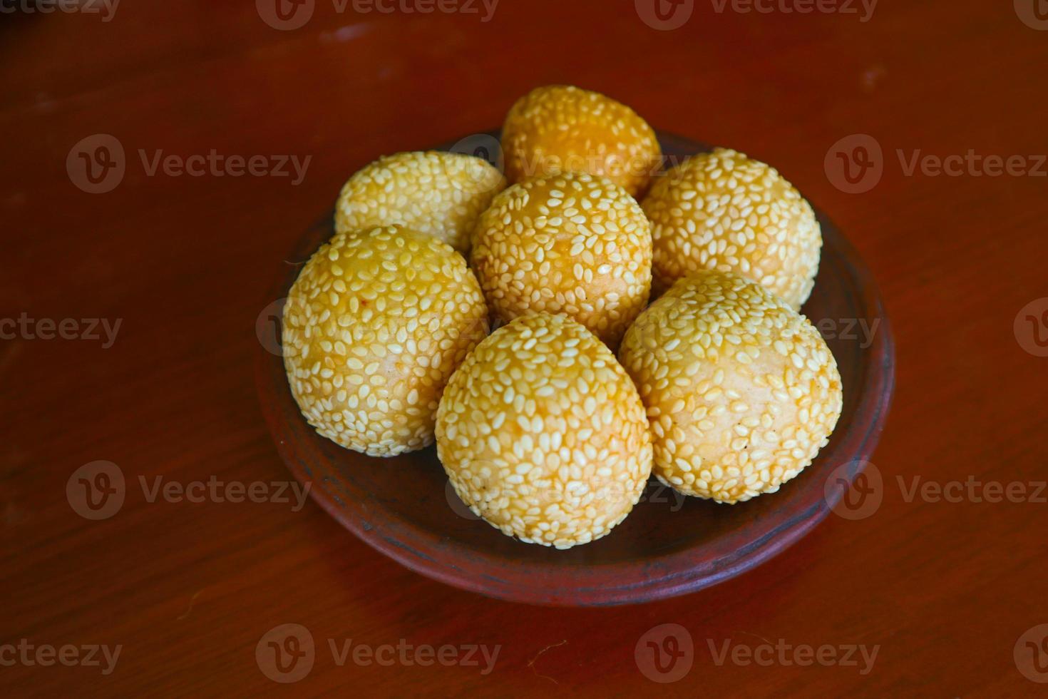 onde-onde or sesame ball or Jian Dui is fried Chinese pastry made from glutinous rice flour and coated with sesame seeds filled with bean paste. isolated on white background photo