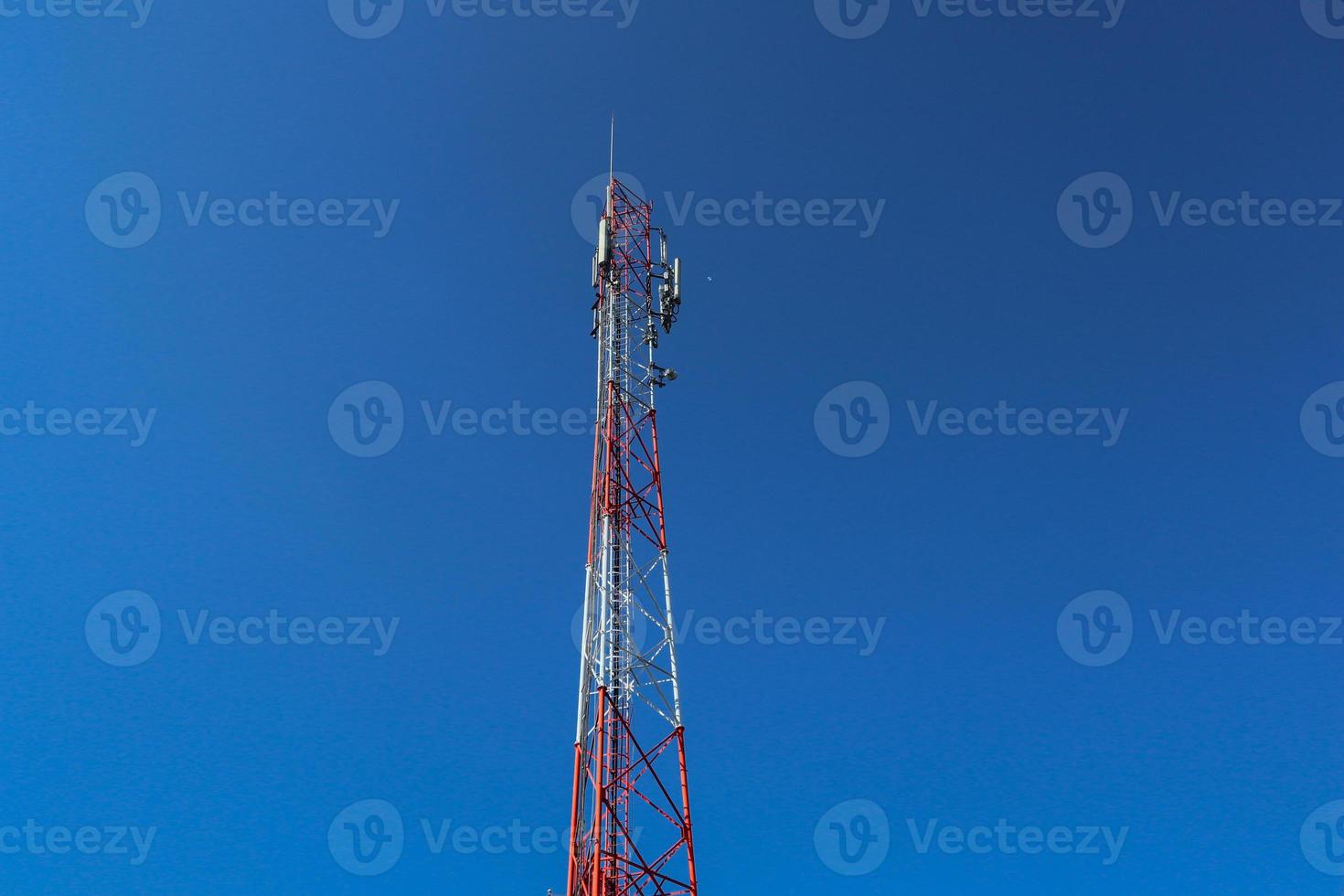 communication tower. Telco Trellis for 3G 4G 5G Apocalypse Internet Communication, mobile, FM Radio and Television Broadcasting On Air with Blue Sky in Background photo