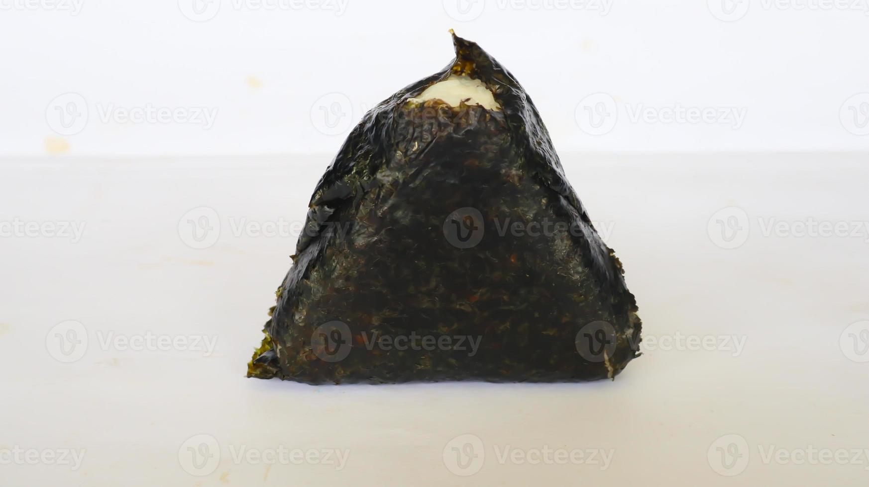Onigiri is Japanese food, Japanese rice ball, rice triangle with seaweed, nori isolated on with background photo
